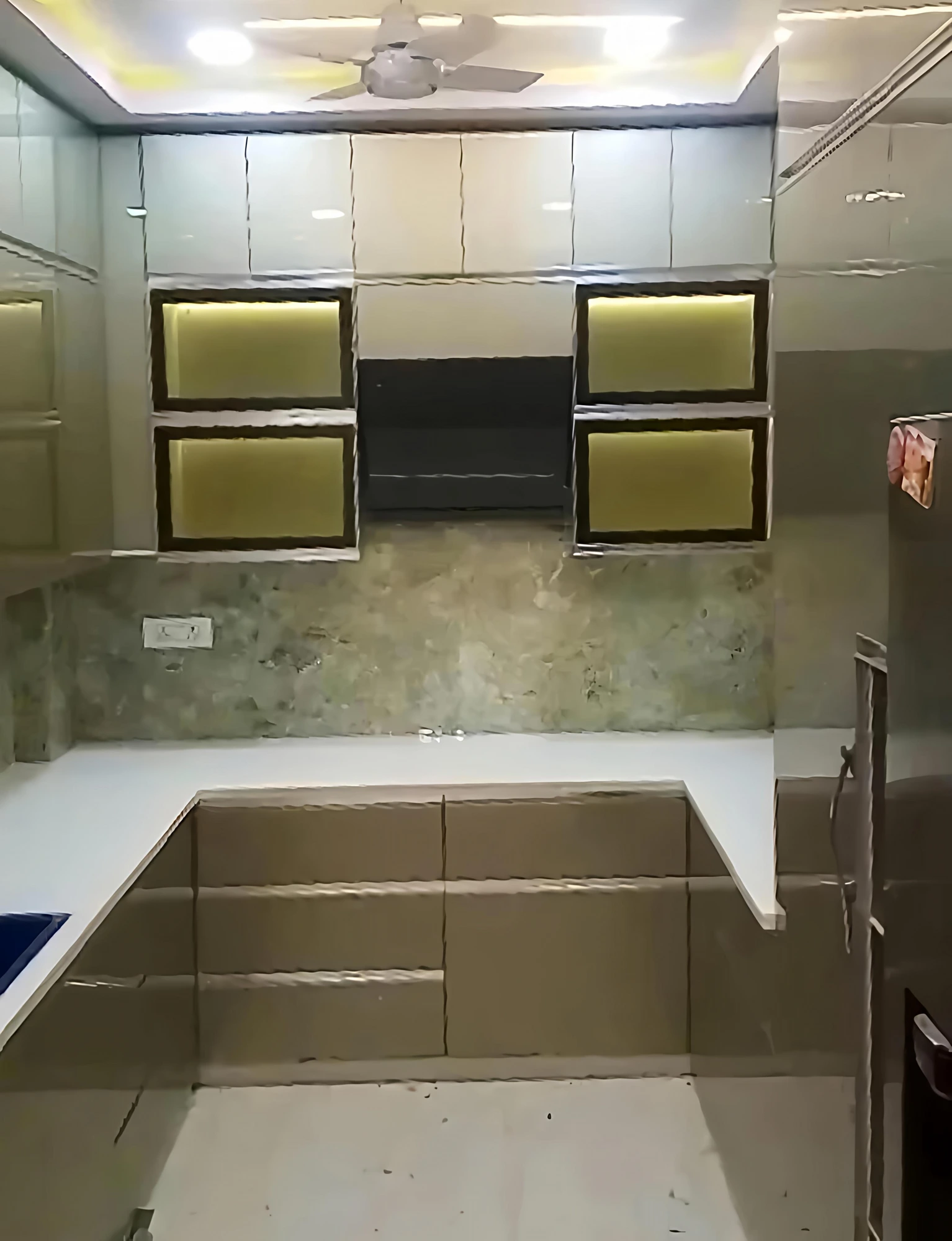 Kitchen with backlit display cabinets and profile lighting