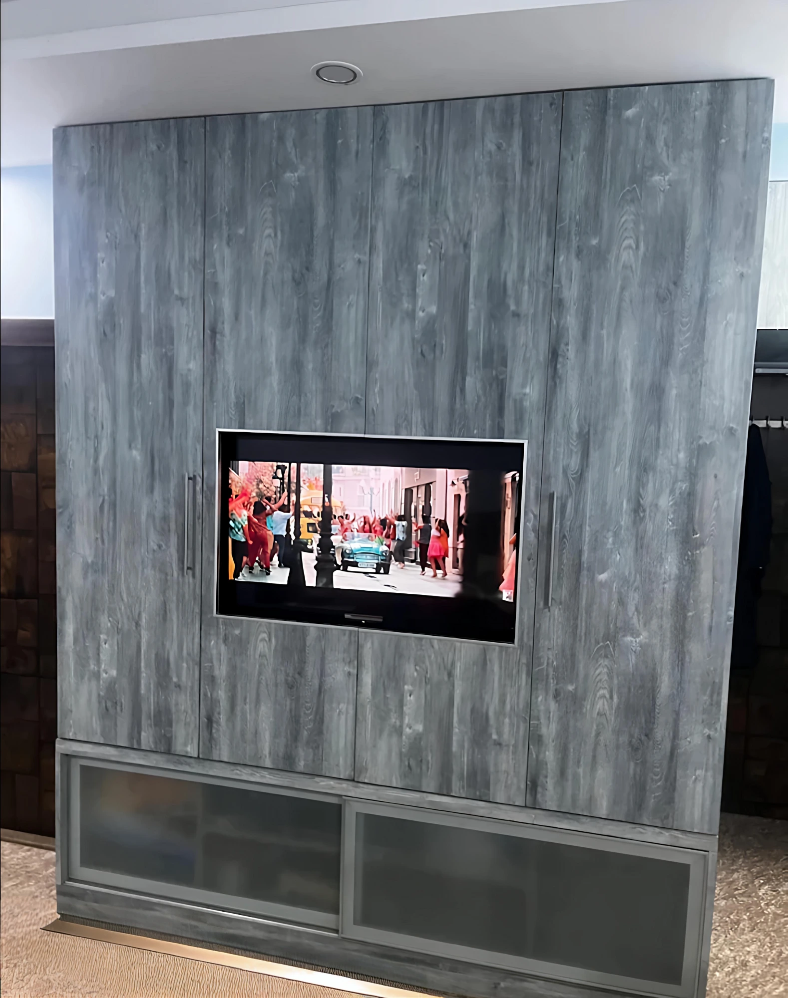 Grey textured TV wall unit with storage